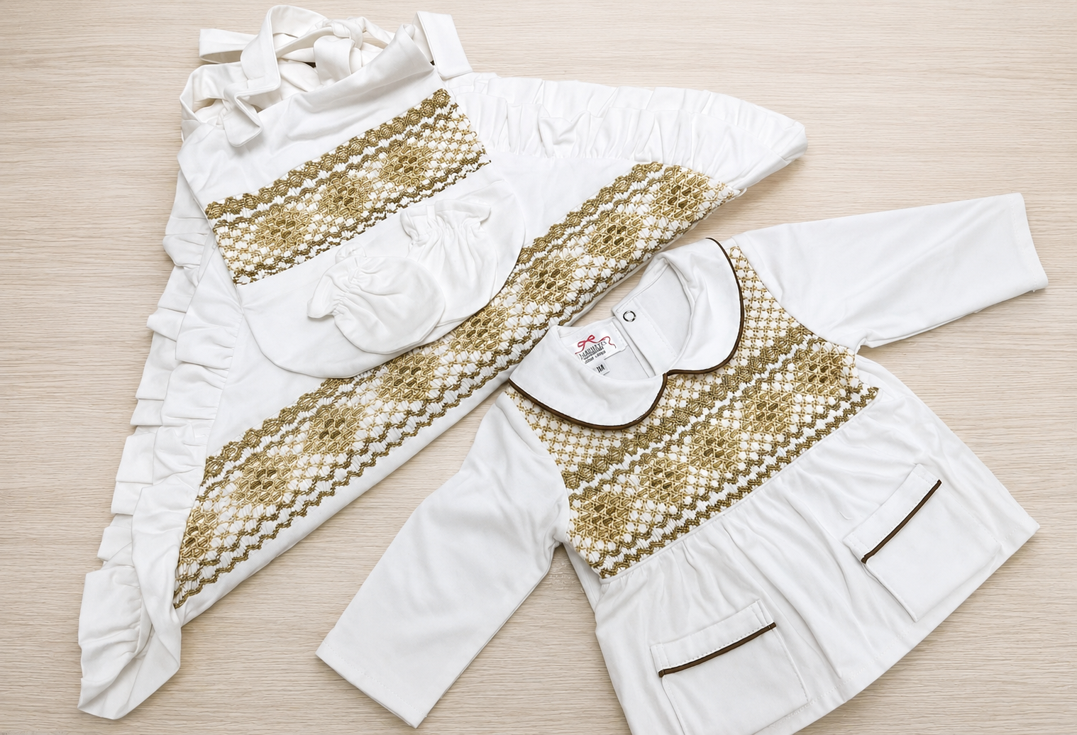 Gold smocked babygrow set